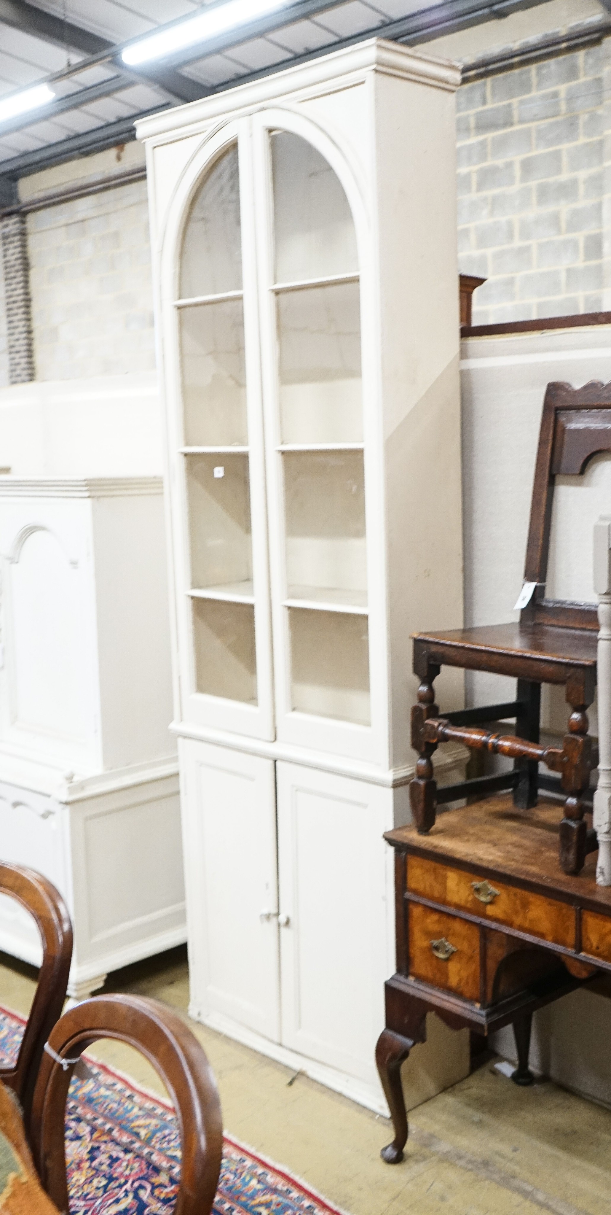 A Victorian style painted pine narrow glazed kitchen cabinet, width 83cm, depth 29cm, height 242cm